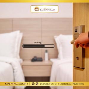 a person opening a door to a hotel room at Hotel Kantipur Plaza in Nepālganj