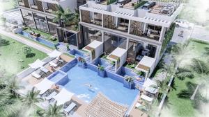 an aerial view of a building with a swimming pool at Loft One Bedroom with Shared Private Pool in Aglantzia