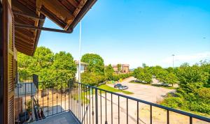 a balcony of a house with a view of a parking lot at Casa Speranza in Narzole