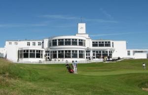 a large white building with people standing in front of it at Stylish 2 Bedroom Coastal Apartment near Crosby Beach & Liverpool in Waterloo