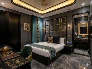 a hotel room with a bed and a bathroom at Hotel DSR Park Near igi Airport Delhi in Majhera