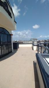 a balcony of a building with a view of the ocean at Smart Residences Apart Go in Cotonou
