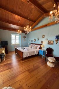 a bedroom with a large bed and a wooden ceiling at Villa Mela by Villas Guide in Barban +23 photos