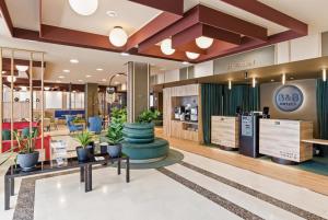 a lobby of a store with potted plants at B&B HOTEL Tarragona Valls in Valls