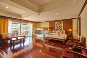 a bedroom with a bed and a living room at Avalon Beach Resort Pattaya in Pattaya South +94 photos