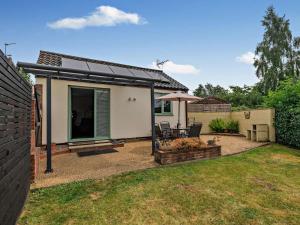 a home with a patio with a table and chairs at 1 Bed in Norwich oc-46293 in Brundall