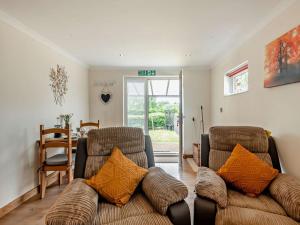 a living room with two chairs and a couch at 1 Bed in Norwich oc-46293 in Brundall