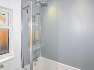 a shower with a glass door in a bathroom at 3 Bed in Whitstable oc-wcc07 in Whitstable +15 photos