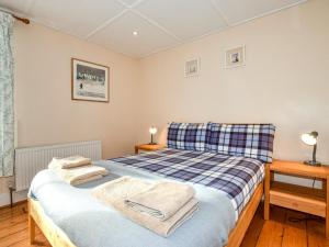a bedroom with a bed with towels on it at 3 Bed in Whitstable oc-wcc07 in Whitstable