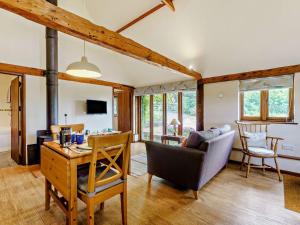 a living room with a couch and a table at 1 Bed in Battle oc-94675 in Warbleton