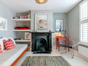 a living room with a fireplace and a couch at 3 Bed in Whitstable oc-wcc17 in Whitstable