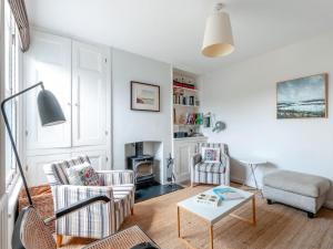 a living room with two chairs and a table at 3 Bed in Whitstable oc-wcc17 in Whitstable