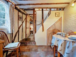 a dining room with a table and chairs at 1 Bed in Northiam oc-bt033 in Northiam