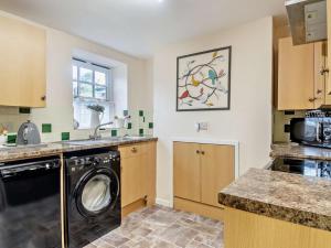 a kitchen with a washer and a dishwasher at 1 Bed in Wymondham oc-43278 in Wymondham