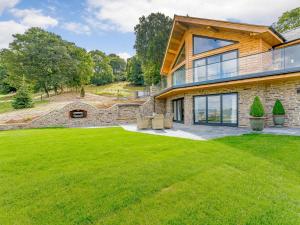 an exterior view of a house with a lawn at 3 Bed in Montgomery oc-88641 in Llandyssil