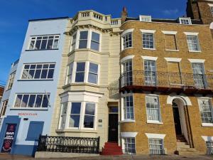 a large brick building with a balcony on it at 5 Bed in Margate oc-86551 in Margate