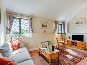 a living room with a couch and a table at 1 Bed in Tunbridge Wells oc-79180 in Wadhurst