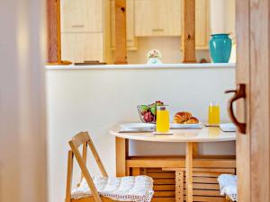 a kitchen with a table with a plate of food on it at 1 Bed in Tunbridge Wells oc-79180 in Wadhurst +6 photos