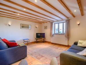 a living room with two couches and a television at 3 Bed in Corpusty oc-ottn8 in Corpusty