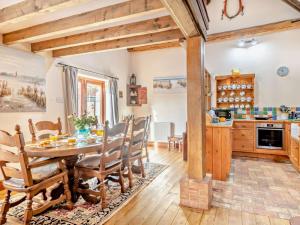 a kitchen and dining room with a table and chairs at 3 Bed in Kings Lynn oc-75673 in Tattersett