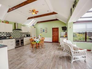 a kitchen and dining room with a table and chairs at 2 Bed in Louth oc-74152 in North Somercotes