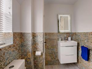 a bathroom with a toilet and a sink and a mirror at 2 Bed in Holt oc-72898 in Holt +6 photos