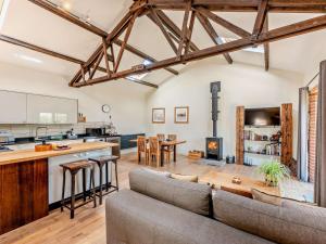 an open living room with a couch and a kitchen at 1 Bed in Chichester oc-77402 in Eastergate