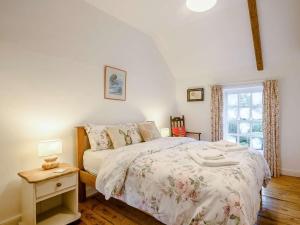 a bedroom with a bed and a window at 5 Bed in Dereham oc-89542 in Swanton Morley