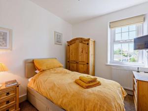 a bedroom with a bed with two towels on it at 3 Bed in Bognor Regis oc-83115 in Bognor Regis