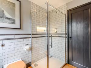 a shower with a glass door in a bathroom at 3 Bed in Faversham oc-78880 in Faversham +16 photos
