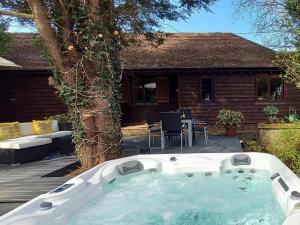 a hot tub in the backyard of a house at 2 Bed in Bedford oc-79558 in Wyboston