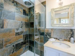 a bathroom with a sink and a mirror at 1 Bed in Lewes oc-79182 in Beddingham +12 photos