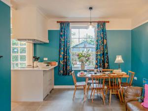 a kitchen and dining room with a table and chairs at 3 Bed in Colchester oc-94016 in Dedham