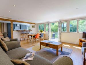 a living room with a couch and a table at 2 Bed in Uckfield oc-80504 in Framfield