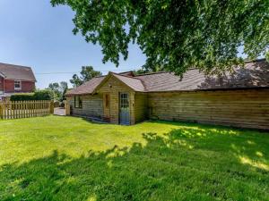 an old wooden house with a grass yard at 2 Bed in Uckfield oc-80504 in Framfield