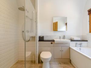 a bathroom with a toilet and a sink and a shower at 1 Bed in Cranbrook oc-76565 in Rolvenden +15 photos