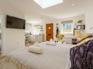 a bedroom with a large bed with two pillows on it at 1 Bed in Broadstairs oc-89391 in Broadstairs