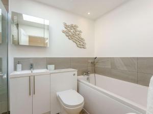 a bathroom with a toilet and a sink and a tub at 1 Bed in Broadstairs oc-89391 in Broadstairs