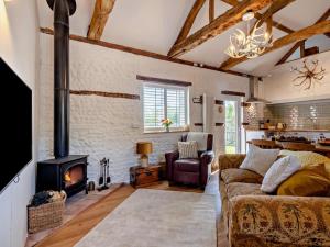 a living room with a couch and a fireplace at 1 Bed in Kings Lynn oc-32202 in Beeston