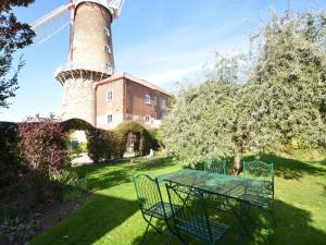 a table and chairs in front of a windmill at 2 Bed in Boston oc-90123 in Boston