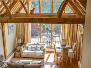 a living room with a couch and a table at 2 Bed in Holt oc-ncc39 in Cley next the Sea