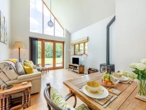 a living room with a table and a fireplace at 1 Bed in Etchingham oc-78940 in Hawkhurst