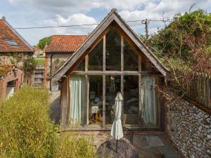 an extension to a house with a large window at 2 Bed in Holt oc-ncc39 in Cley next the Sea