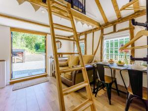 a room with a loft bed in a tiny house at 1 Bed in Ashford oc-82527 in Biddenden