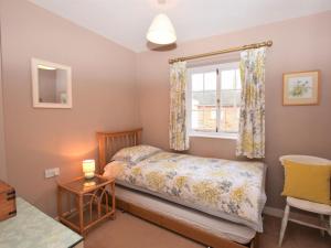a bedroom with a bed and a window at 2 Bed in Colchester oc-42650 in Dedham