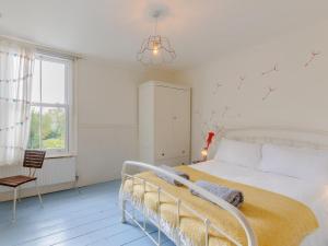 a white bedroom with a white bed and a window at 3 Bed in Whitstable oc-84042 in Whitstable