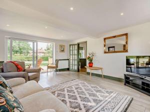 a living room with a couch and a table at 2 Bed in Hailsham oc-89416 in Hailsham