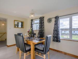a dining room with a wooden table and chairs at 3 Bed in Dereham oc-65903 in Foulsham
