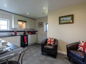 a kitchen with two chairs and a table in a kitchen at 3 Bed in Dereham oc-65903 in Foulsham +8 photos