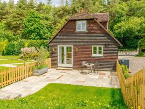 a small house with a patio in a yard at 1 Bed in Battle oc-88029 in Brightling